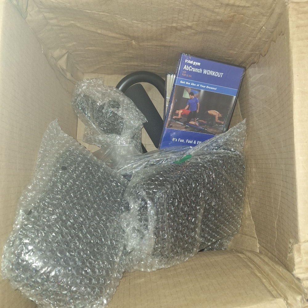 Total Gym Ab Crunch Attachments -Brand New. I know nothing about it.